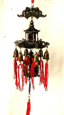 FENG SHUI design - 2 flying dragons holding a phase brand top  of a house of bells, which is hang on outsides of the front door to bring your house with luck.