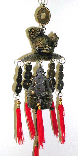 FENG SHUI elements - FENG SHUI turtle-like animal staning top of coin arc and bell. Hang on a specific FENG SHUI location can keep you with wealth.