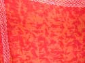 Red orange background with leaf pattern and edge decor Batik sarong wrap