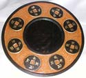 Orange tan crack rounded mirror with multi oriental coin pattern design