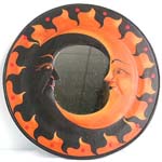Rounded two-moon (black and tan color) wooden mirror