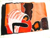 Beautiful wholesale apparel collection, African art figure design on red and orange batik shawl wrap