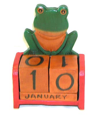 Table decoration - color painted  wooden frog calendar.