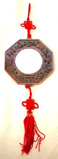 World of FENG SHUI - Metallic 'BA GUA' with evil face holding a sword in mouth. It allways hang out side of the house door to keep the house from devil and bad spirit.