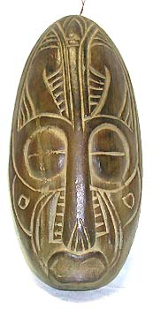 Primitive decoration - brown mask with a  sign on each eye