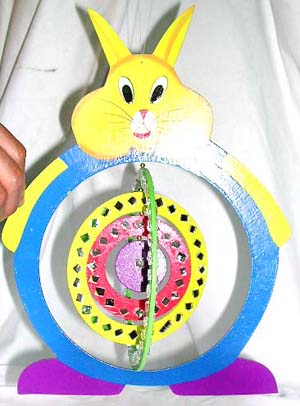 Color painted rabit wood mobile with circular rotating center 