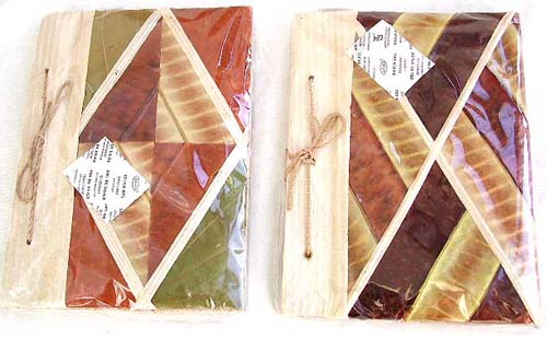 Balinese address book handcrafted and embedded amid green kupu-kupu leaves
