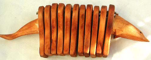 Musical instrument: wooden dolphin cracker
