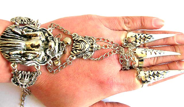 Fashion slave bracelet in double evil head pattern design holding a mini jiggle bell end decor and 3 chain in sharp nail rings fashion         